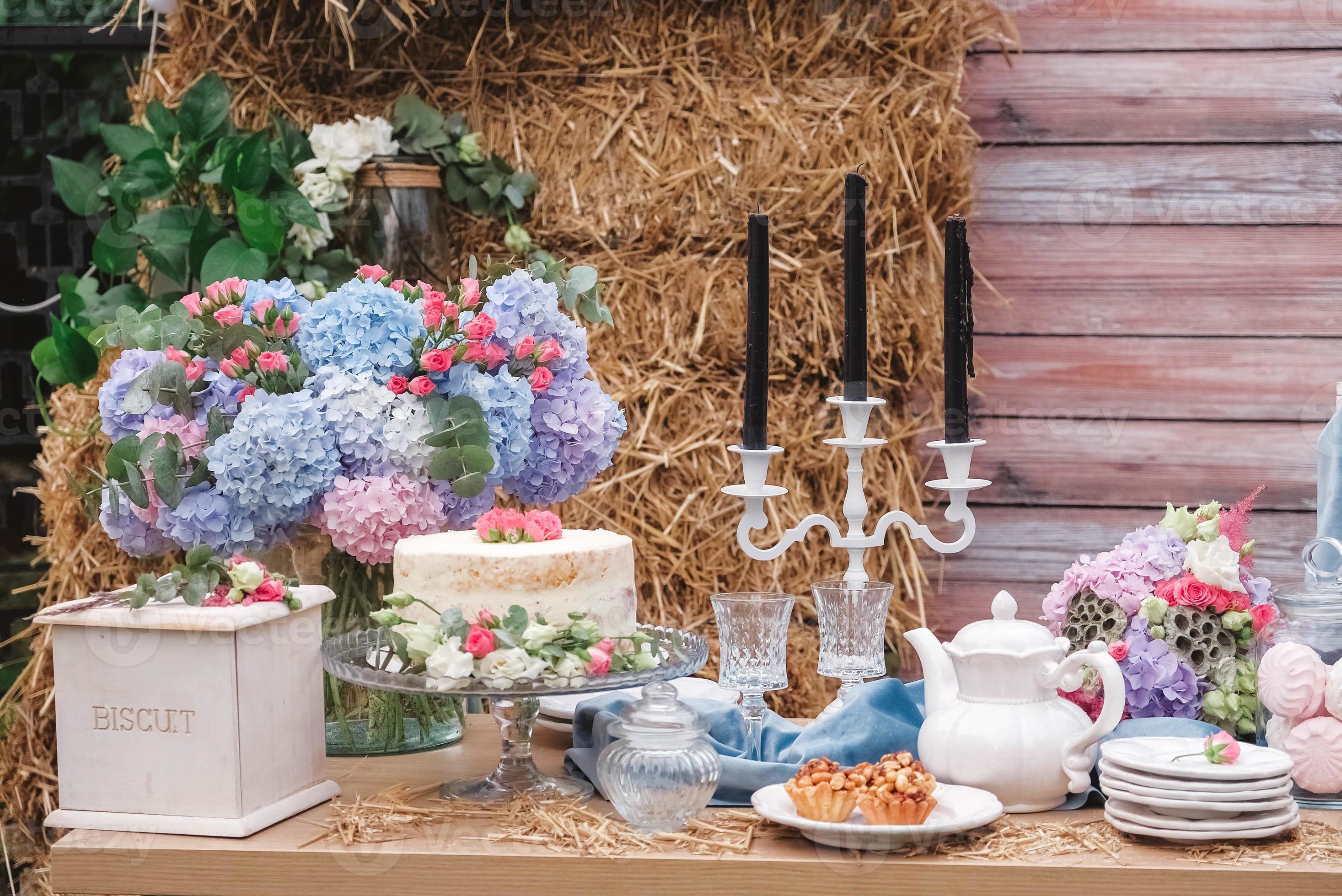 Dessert table styled with flowers and candles