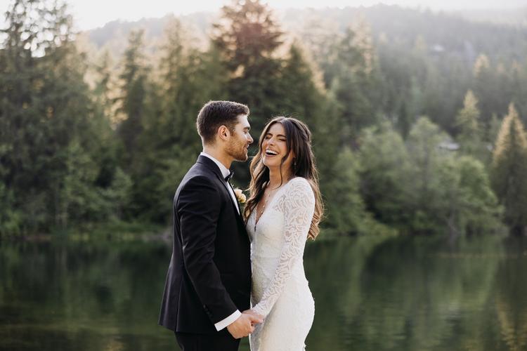 Bride and groom sharing a candid laugh
