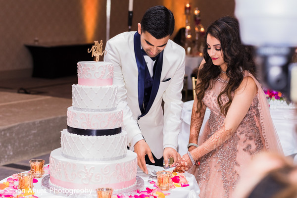 Couple cutting an anniversary cake